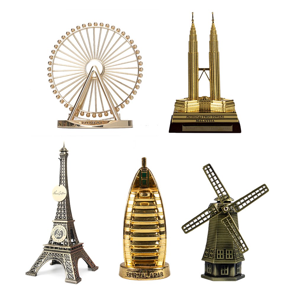 Metal souvenir ornaments including a Ferris wheel and architectural tower models
