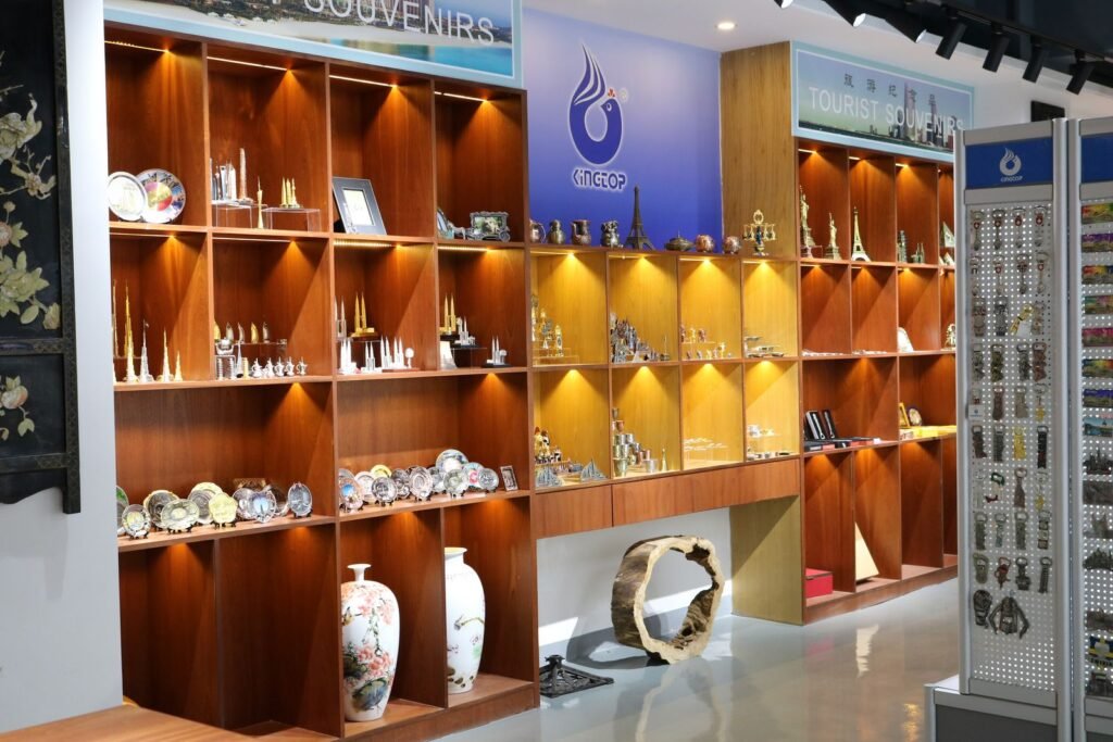 Backlit showroom wall with trophies, awards and metal gift samples