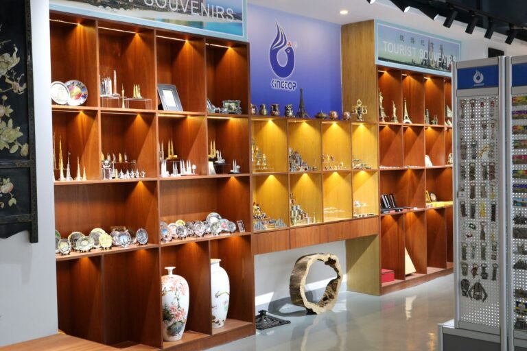 Backlit showroom wall with trophies, awards and metal gift samples