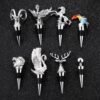 Assorted silver plated animal wine stoppers with horned skull and bird toppers