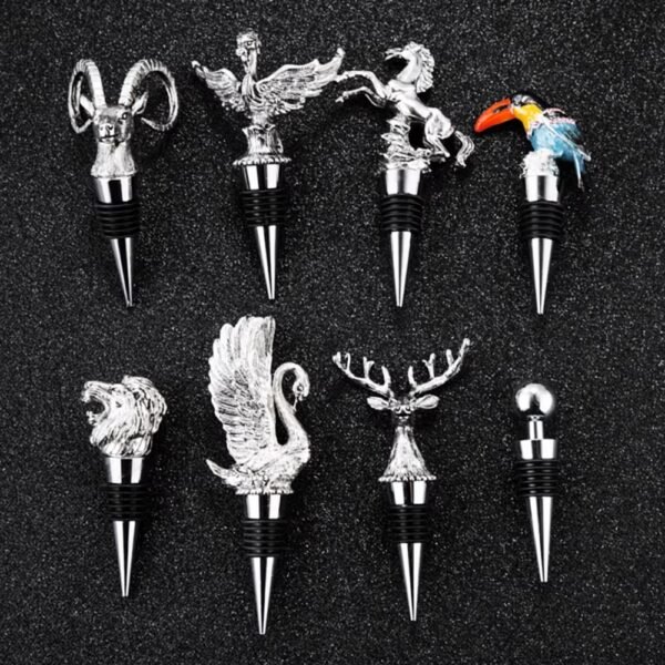 Assorted silver plated animal wine stoppers with horned skull and bird toppers