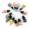 Collection of metal wine stoppers with animal head designs in varied finishes