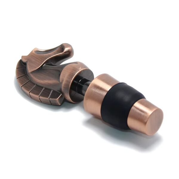 Copper plated dinosaur head wine stopper fitted on a bottle neck