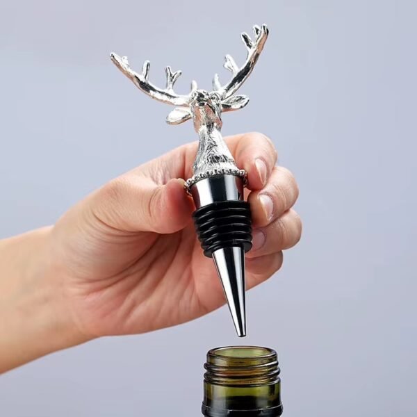 Hand holding a zinc alloy deer antler wine stopper